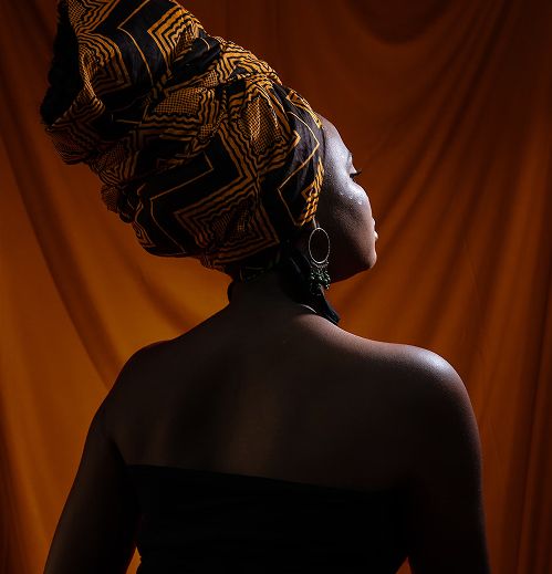 Woman wearing a head covering and a dress